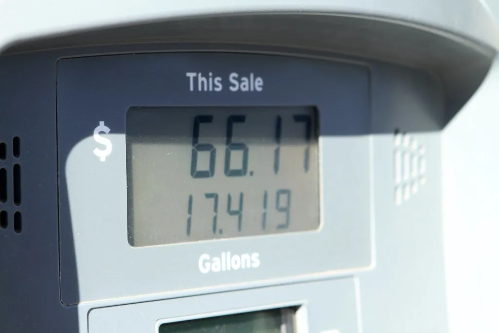 Close view of a gas pump display showing the dollar total and gallons for one fill-up