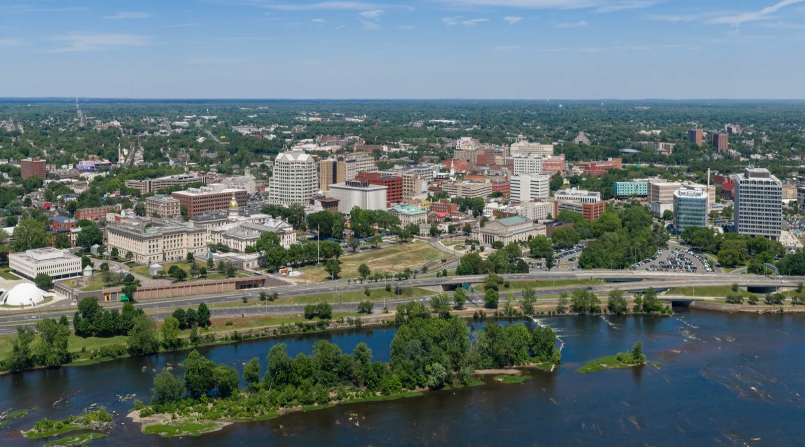 Aerial view of downtown Trenton, the capital of New Jersey, beside the Delaware River on a clear summer day